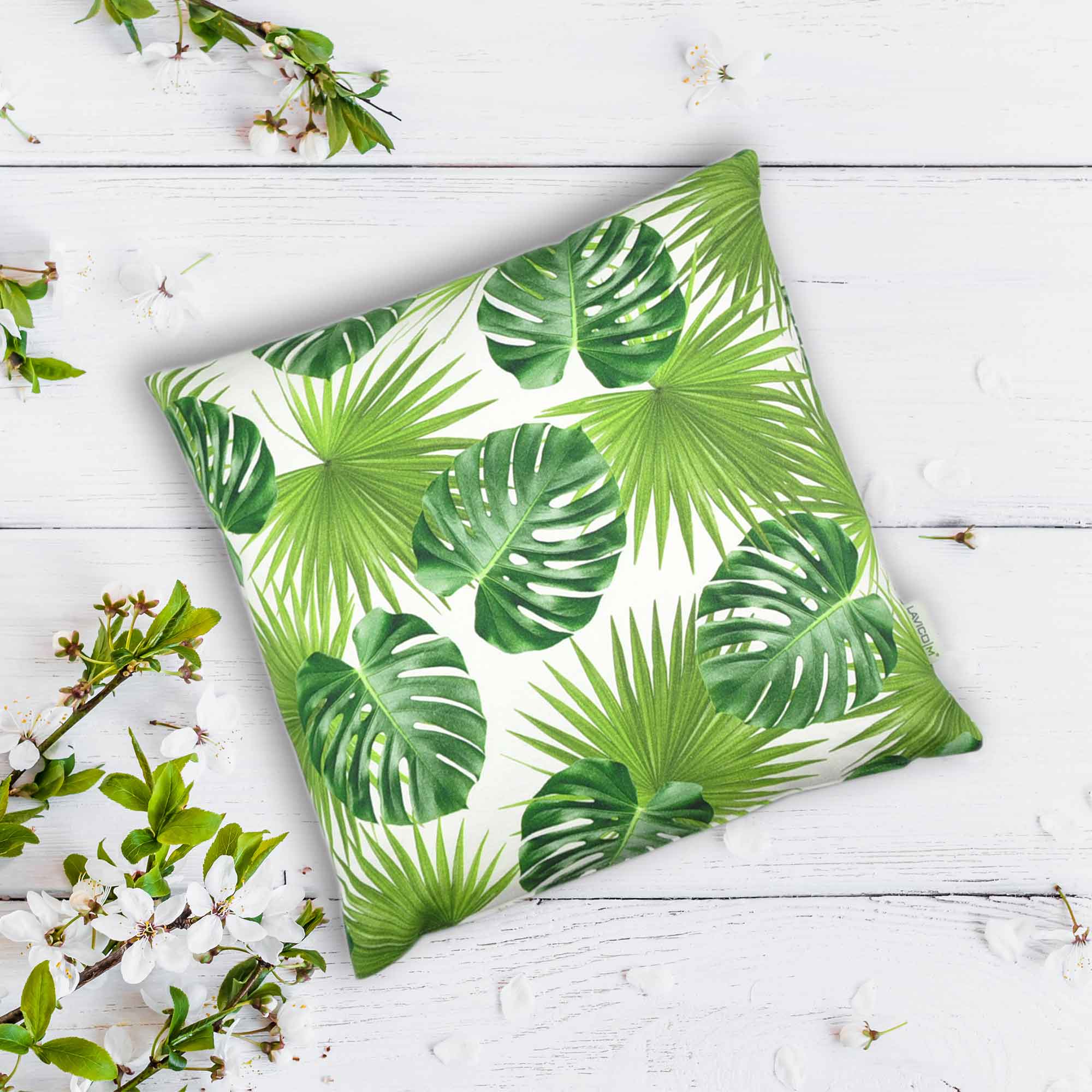 Couchkissen mit großen Palmenblättern